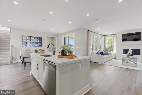 Dining room, Fireplace, Interior, Kitchen, Living room, Recessed Lighting, Stainless Steel Appliances, Wood Texture Flooring