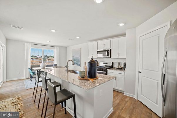 Dining room, Interior, Kitchen, Recessed Lighting, Stainless Steel Appliances, Wood Texture Flooring