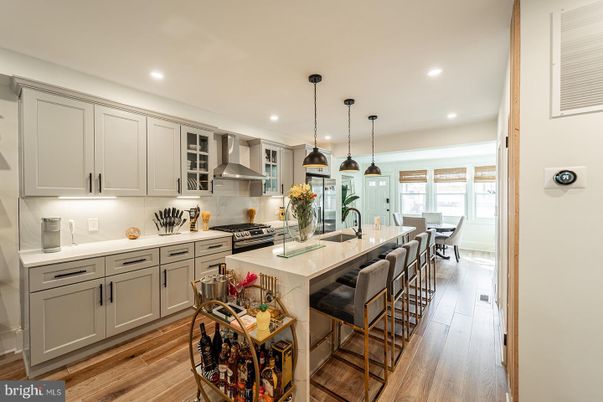 Dining room, Interior, Kitchen, Pendant Lights, Recessed Lighting, Stainless Steel Appliances, Wood Texture Flooring