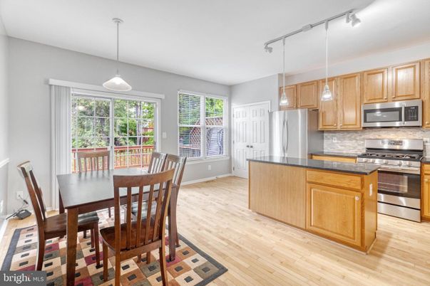Dining room, Interior, Kitchen, Pendant Lights, Stainless Steel Appliances, Wood Texture Flooring