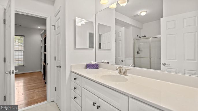 Bathroom, Dual Sink Vanities, Glass Shower, Interior, Recessed Lighting, Wood Texture Flooring
