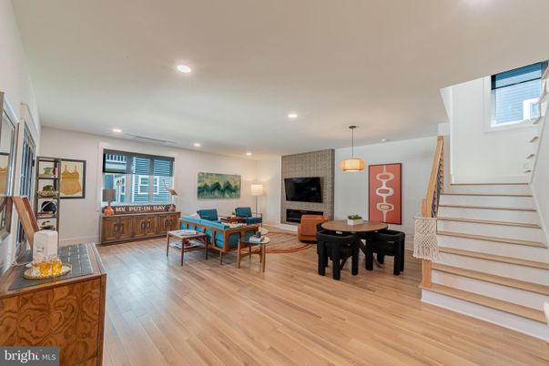 Dining room, Fireplace, Interior, Living room, Pendant Lights, Recessed Lighting, Wood Texture Flooring