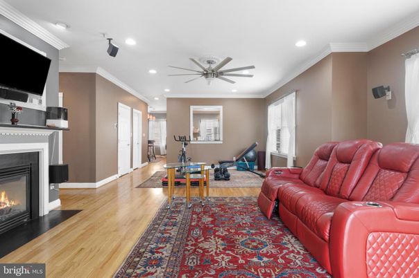 Fireplace, Fitness Equipment, Interior, Living room, Recessed Lighting, Wood Texture Flooring