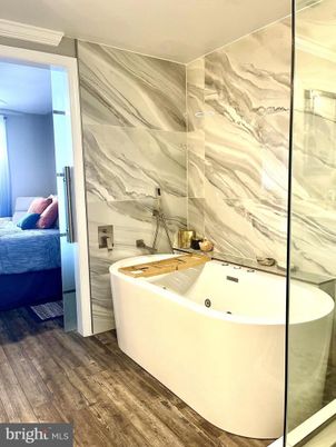 Bathroom, Bedroom, Free Standing Baths, Glass Shower, Interior, Marble Walls, Wood Texture Flooring