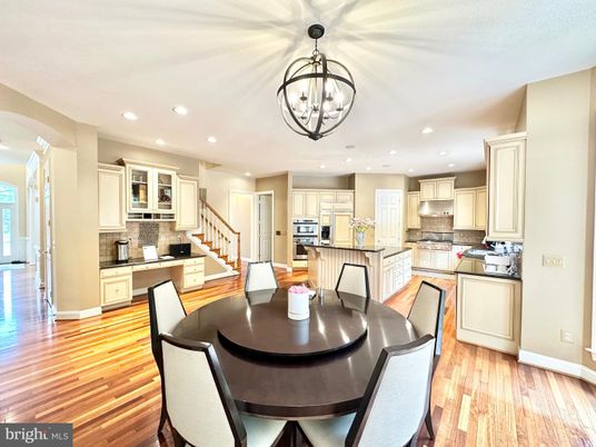 Chandelier, Dining room, Interior, Kitchen, Pendant Lights, Recessed Lighting, Stainless Steel Appliances, Wood Texture Flooring