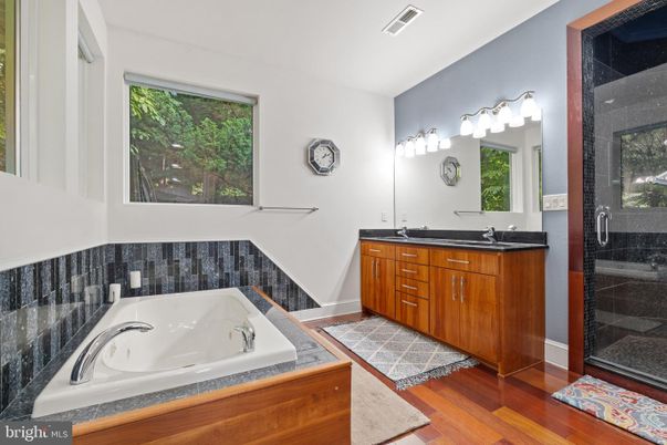 Bathroom, Dual Sink Vanities, Glass Shower, Interior, Tile Countertops, Wood Texture Flooring
