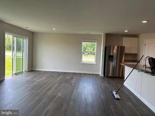 Empty room, Interior, Kitchen, Recessed Lighting, Stainless Steel Appliances, Wood Texture Flooring