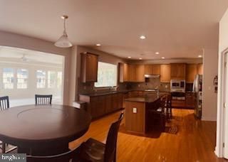 Dining room, Interior, Kitchen, Pendant Lights, Recessed Lighting, Stainless Steel Appliances, Wood Texture Flooring