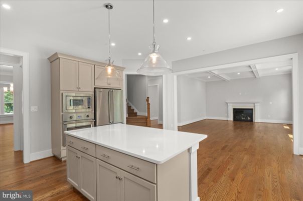 Fireplace, Interior, Kitchen, Pendant Lights, Recessed Lighting, Stainless Steel Appliances, Wood Texture Flooring