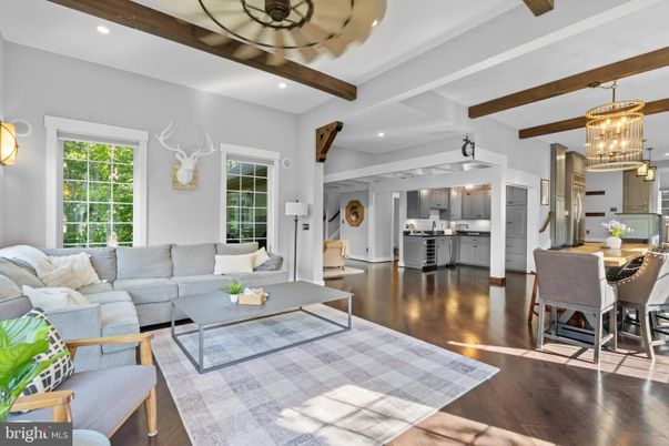 Chandelier, Dining room, Interior, Kitchen, Living room, Pendant Lights, Recessed Lighting, Stainless Steel Appliances, Wooden Beams, Wood Texture Flooring