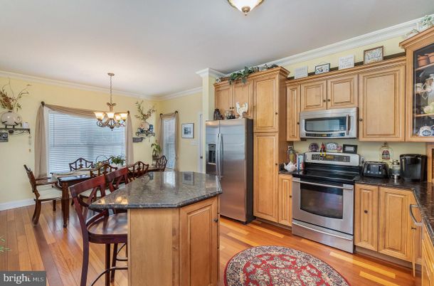 Chandelier, Dining room, Interior, Kitchen, Stainless Steel Appliances, Wood Texture Flooring