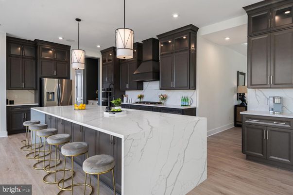 Interior, Kitchen, Marble Walls, Pendant Lights, Recessed Lighting, Stainless Steel Appliances, Wood Texture Flooring