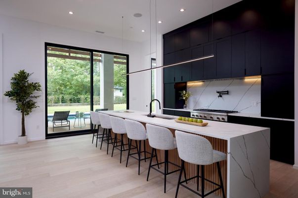 Interior, Kitchen, Marble Walls, Pendant Lights, Recessed Lighting, Stainless Steel Appliances, Wood Texture Flooring