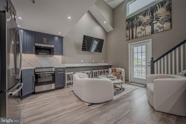 Interior, Kitchen, Living room, Marble Walls, Recessed Lighting, Stainless Steel Appliances, Wood Texture Flooring