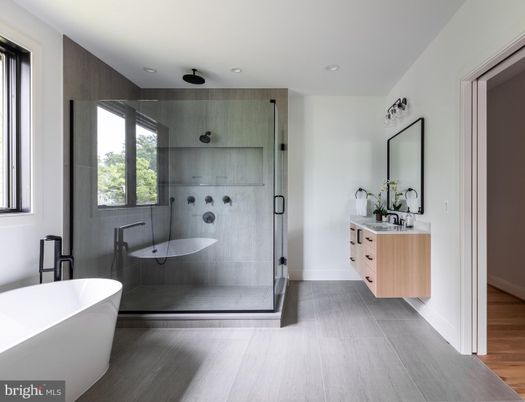 Bathroom, Dual Sink Vanities, Free Standing Baths, Glass Shower, Interior, Recessed Lighting, Wood Texture Flooring