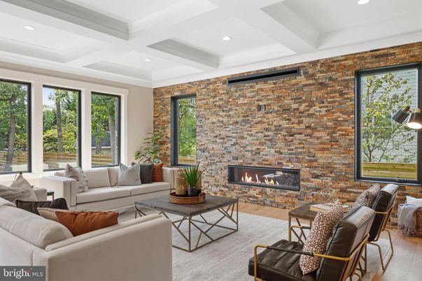 Fireplace, Interior, Living room, Recessed Lighting, Stone Walls, Wood Texture Flooring