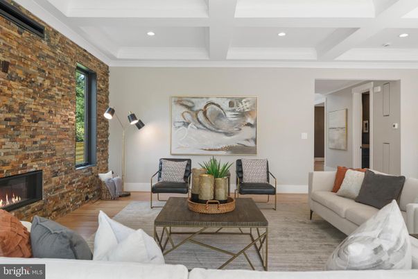 Fireplace, Interior, Living room, Recessed Lighting, Stone Walls, Wood Texture Flooring