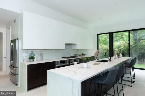 Interior, Kitchen, Marble Walls, Recessed Lighting, Stainless Steel Appliances