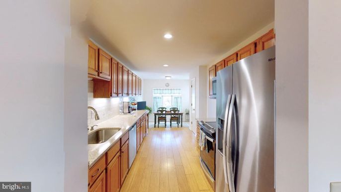 Dining room, Interior, Kitchen, Recessed Lighting, Stainless Steel Appliances, Wood Texture Flooring