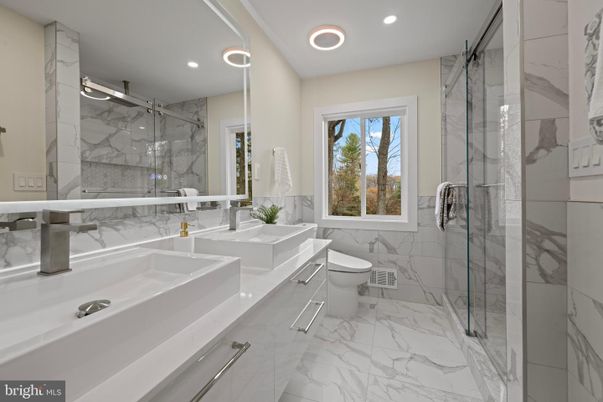 Bathroom, Dual Sink Vanities, Glass Shower, Interior, Marble, Marble Walls, Recessed Lighting