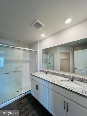 Bathroom, Dual Sink Vanities, Glass Shower, Interior, Recessed Lighting, Wood Texture Flooring