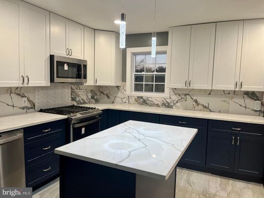 Interior, Kitchen, Marble Walls, Pendant Lights, Recessed Lighting, Stainless Steel Appliances