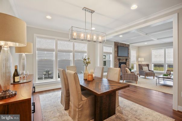 Dining room, Fireplace, Interior, Living room, Pendant Lights, Recessed Lighting, Wood Texture Flooring