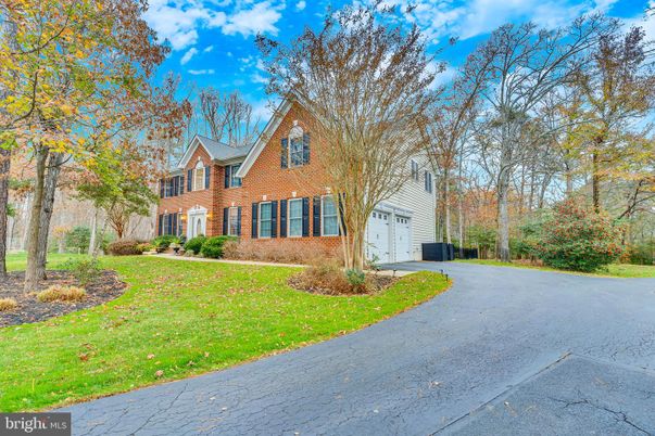 Attached, Backyard, Exterior, Facade, Brick Facade, Tudor Revival