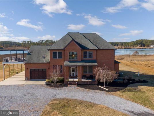 Attached, Exterior, Facade, Brick Facade, Water, Brick Traditional