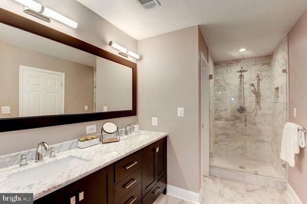Bathroom, Dual Sink Vanities, Glass Shower, Interior, Marble, Marble Walls, Recessed Lighting