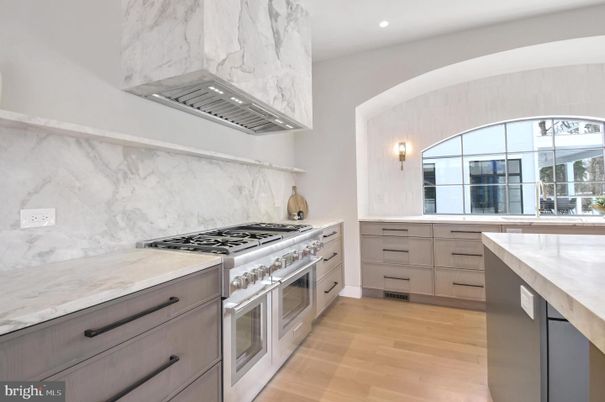 Interior, Kitchen, Marble Walls, Recessed Lighting, Stainless Steel Appliances, Wood Texture Flooring
