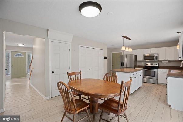 Dining room, Interior, Kitchen, Pendant Lights, Stainless Steel Appliances, Wood Texture Flooring