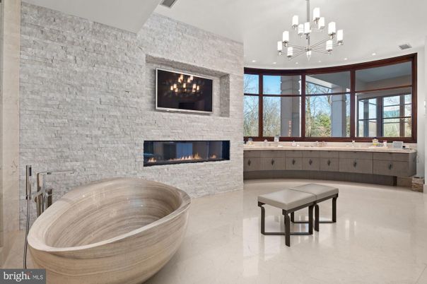 Bathroom, Fireplace, Free Standing Baths, Interior, Marble, Pendant Lights, Recessed Lighting, Stone Walls