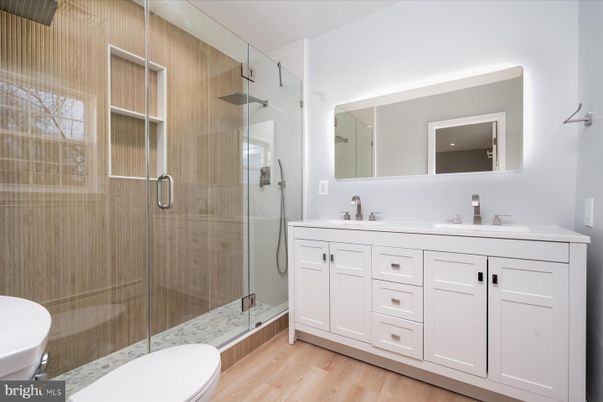 Bathroom, Dual Sink Vanities, Glass Shower, Interior, Wood Texture Flooring