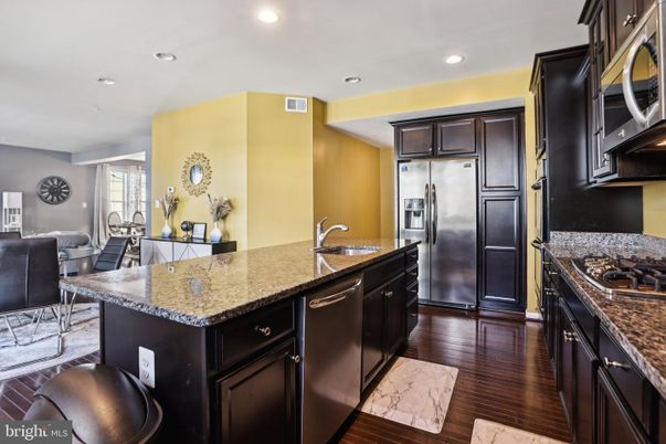 Dining room, Interior, Kitchen, Recessed Lighting, Stainless Steel Appliances, Wood Texture Flooring