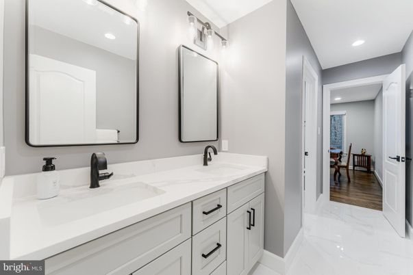Bathroom, Dual Sink Vanities, Interior, Marble, Recessed Lighting, Wood Texture Flooring