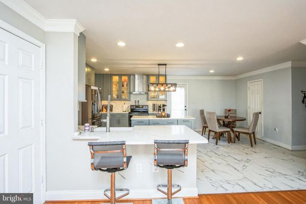 Chandelier, Dining room, Interior, Kitchen, Marble, Pendant Lights, Recessed Lighting, Stainless Steel Appliances, Wood Texture Flooring