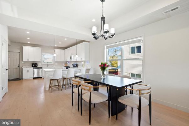 Chandelier, Dining room, Interior, Kitchen, Pendant Lights, Recessed Lighting, Stainless Steel Appliances, Wood Texture Flooring