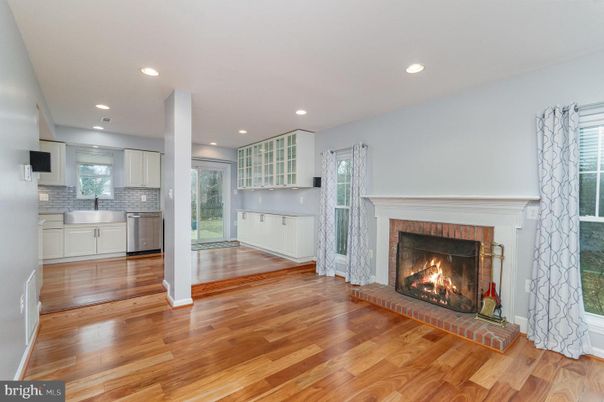 Fireplace, Interior, Kitchen, Recessed Lighting, Stainless Steel Appliances, Wood Texture Flooring
