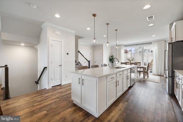 Dining room, Interior, Kitchen, Pendant Lights, Recessed Lighting, Stainless Steel Appliances, Wood Texture Flooring
