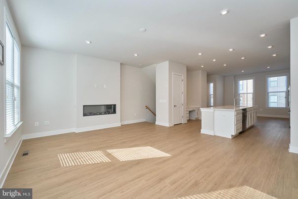 Empty room, Fireplace, Interior, Kitchen, Recessed Lighting, Wood Texture Flooring
