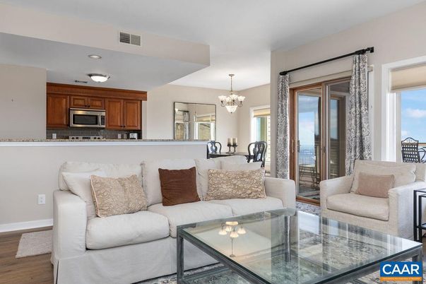 Chandelier, Dining room, Interior, Kitchen, Living room, Stainless Steel Appliances, Wood Texture Flooring