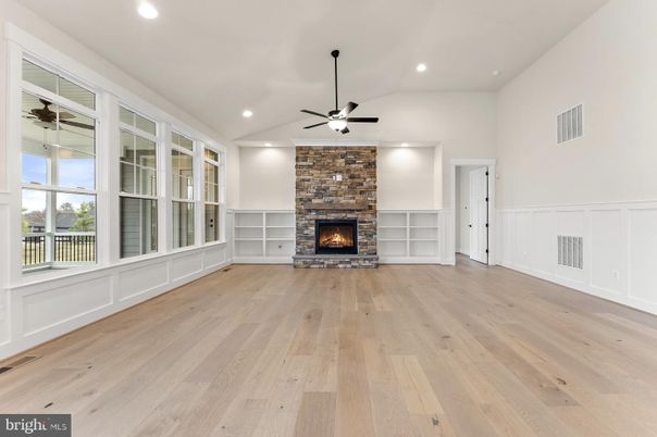 Empty room, Fireplace, Interior, Recessed Lighting, Stone Walls, Wood Texture Flooring
