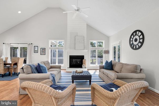 Dining room, Fireplace, Interior, Living room, Recessed Lighting, Wood Texture Flooring