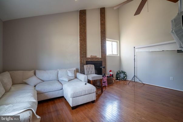 Fireplace, Interior, Living room, Recessed Lighting, Stone Walls, Wood Texture Flooring