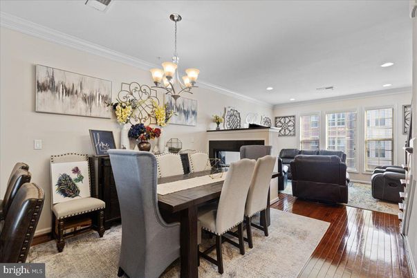 Chandelier, Dining room, Fireplace, Interior, Living room, Recessed Lighting, Wood Texture Flooring