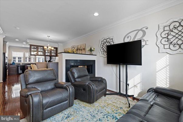 Chandelier, Dining room, Fireplace, Interior, Living room, Recessed Lighting, Wood Texture Flooring
