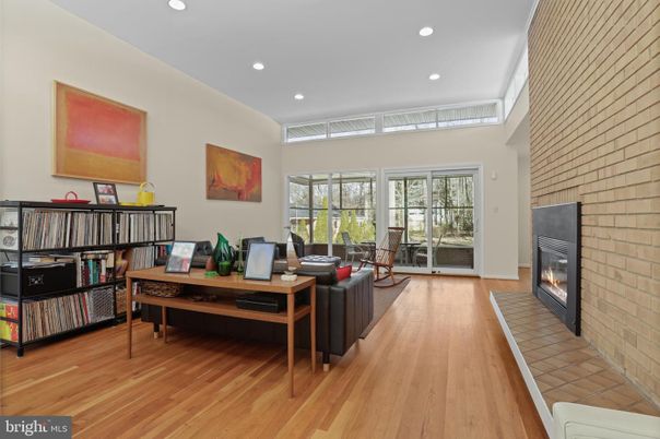 Fireplace, Interior, Living room, Recessed Lighting, Stone Walls, Wood Texture Flooring
