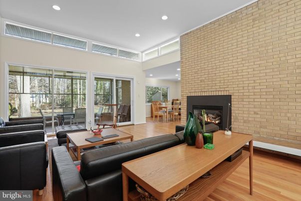 Dining room, Fireplace, Interior, Living room, Recessed Lighting, Stone Walls, Wood Texture Flooring