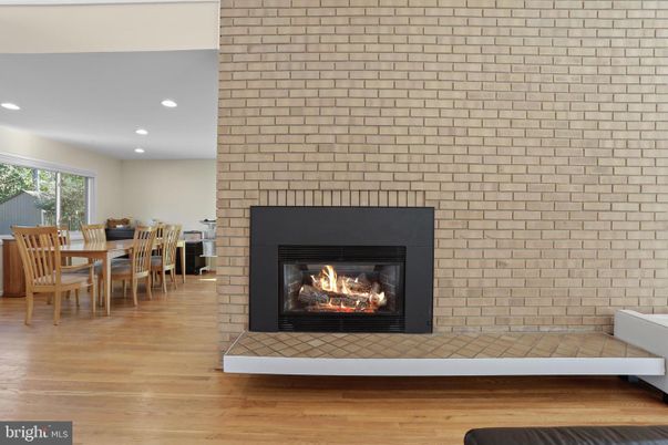 Dining room, Fireplace, Interior, Recessed Lighting, Stone Walls, Wood Texture Flooring